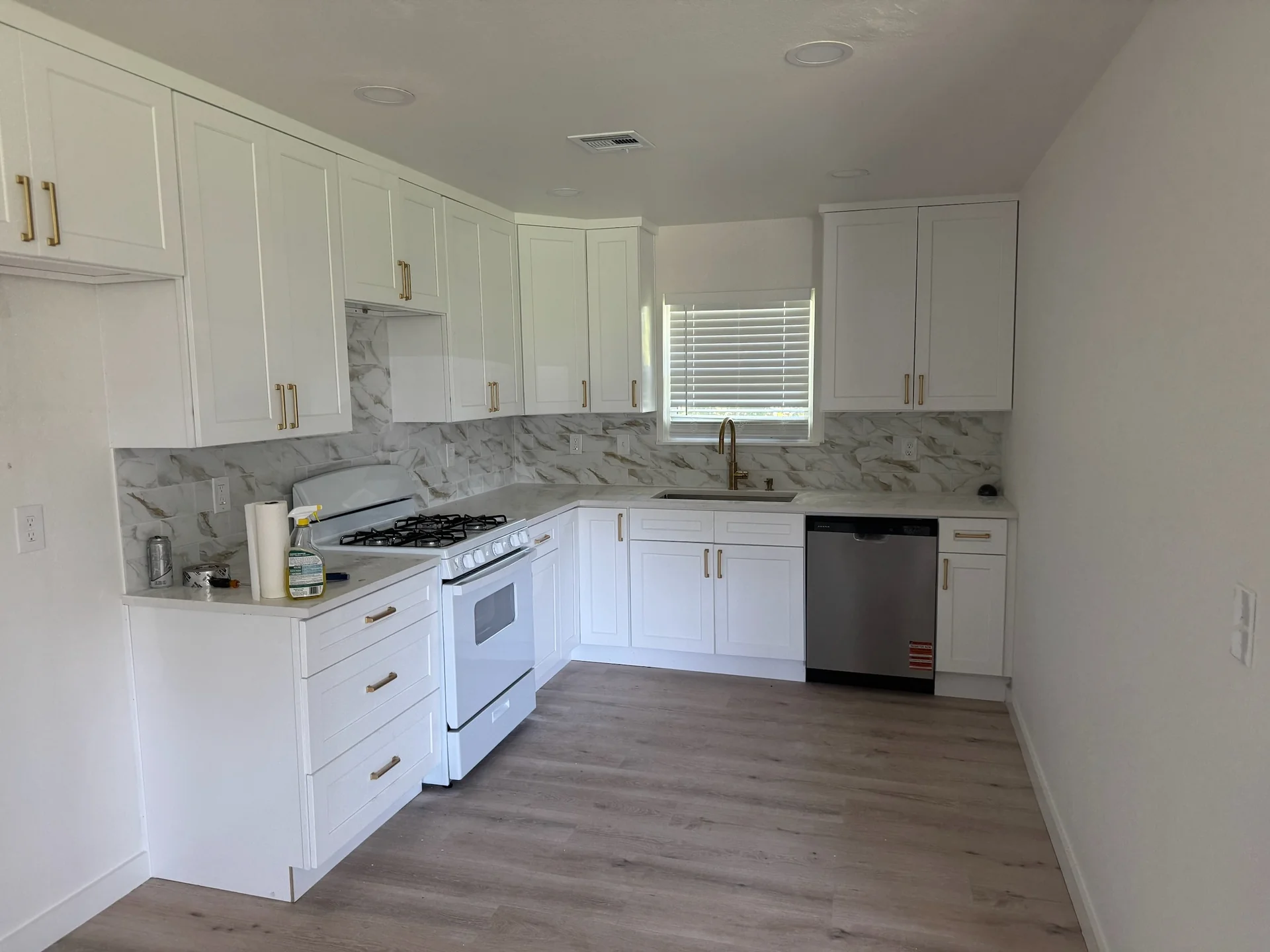Kitchen renovation with island pendant lighting and recessed ceiling lights
